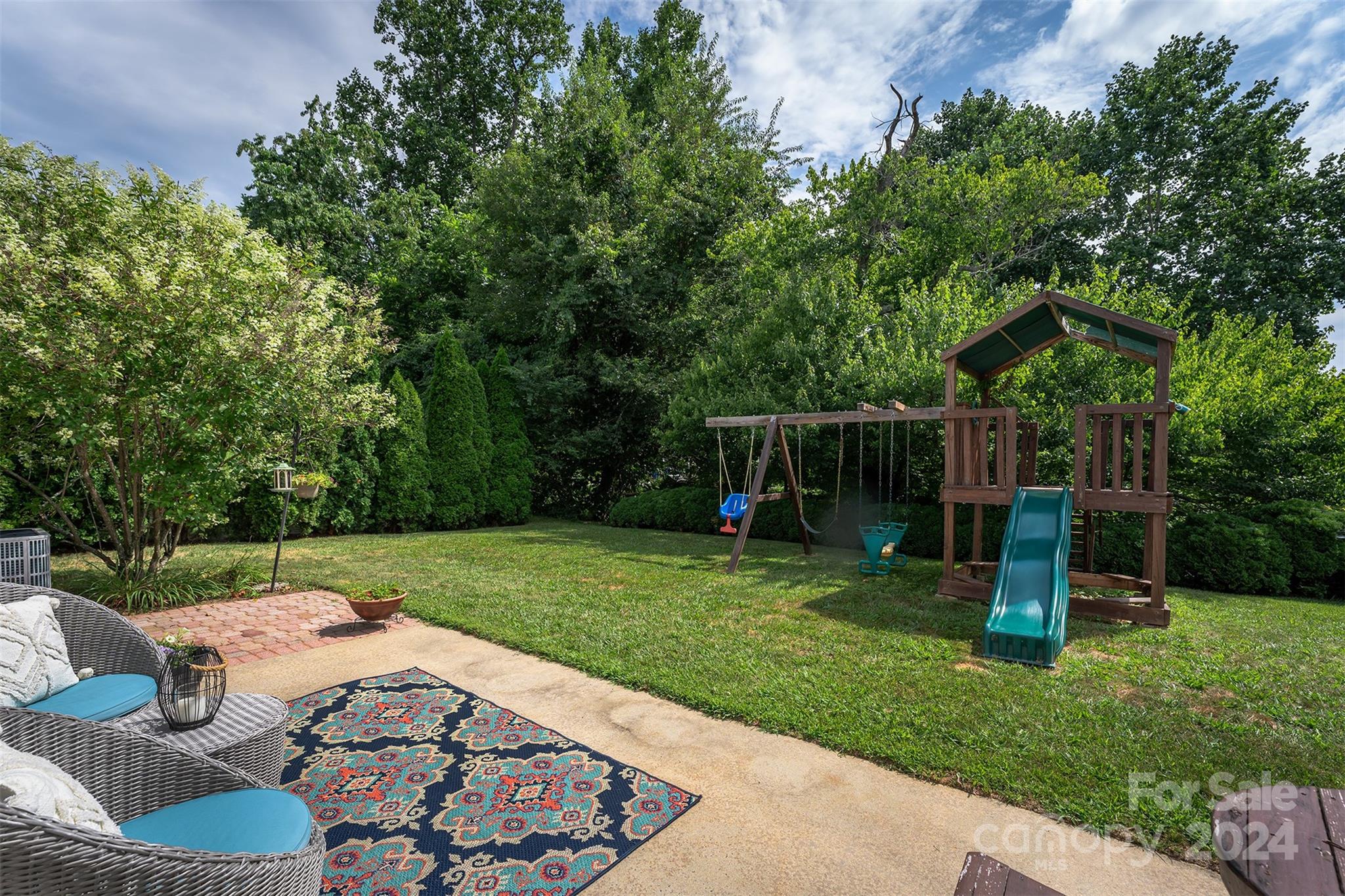 311 Planters Creek Road Fletcher, NC 28732 - Photo 22 of 24 a garden view with a seating space