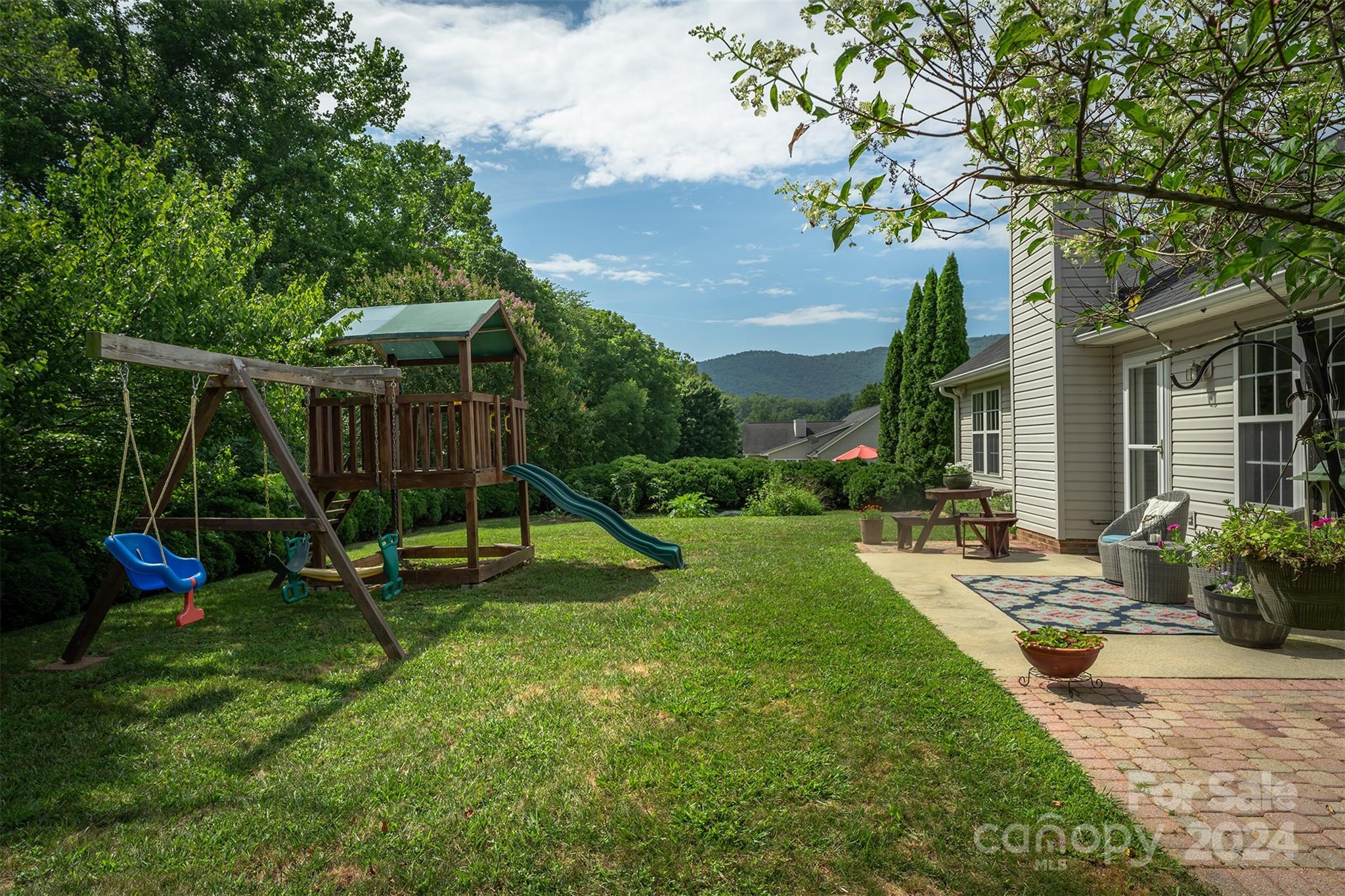 311 Planters Creek Road Fletcher, NC 28732 - Photo 23 of 24 a view of playground with a slide and a large tree