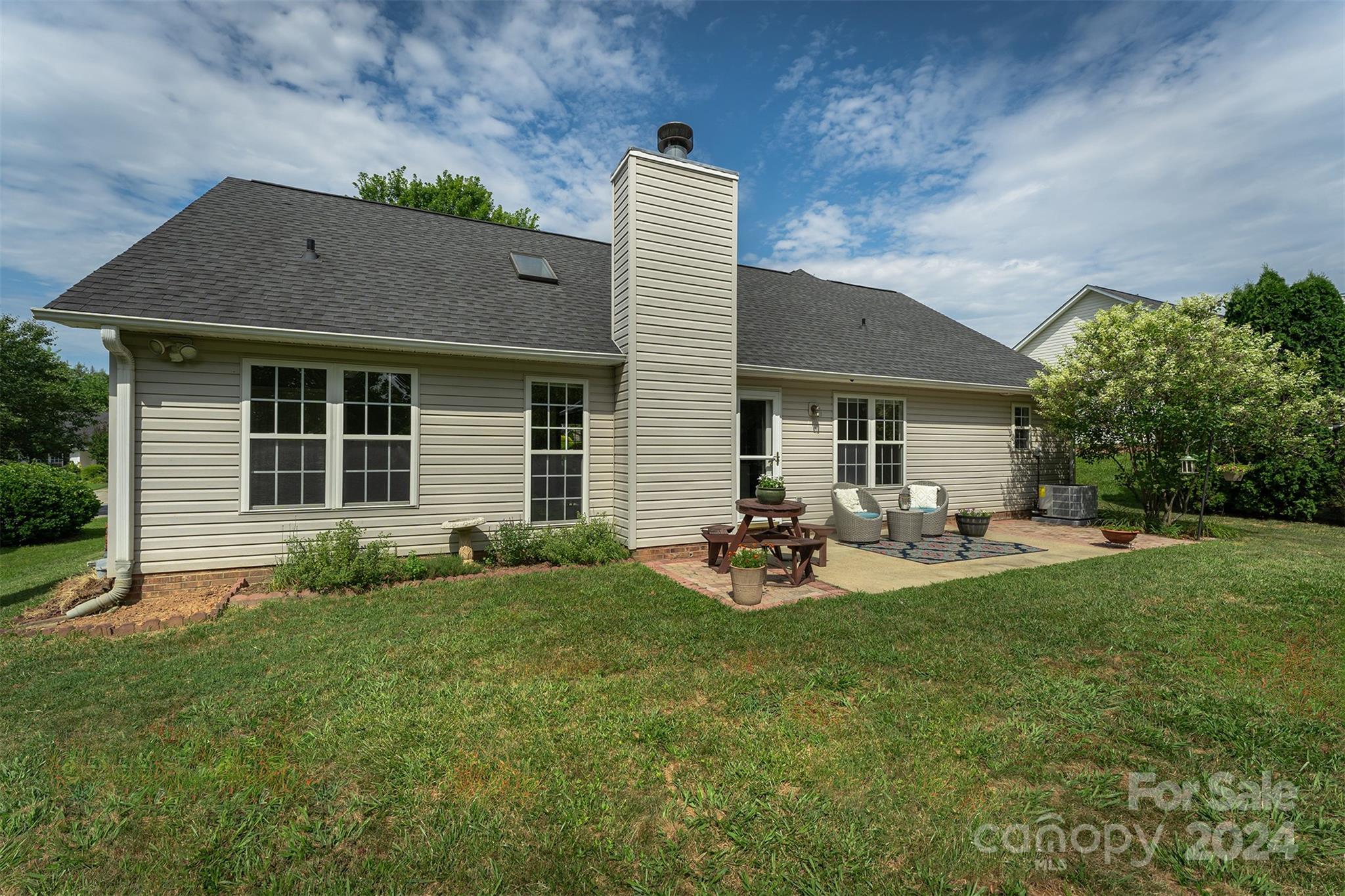 311 Planters Creek Road Fletcher, NC 28732 - Photo 24 of 24 a front view of a house with sitting area and garden