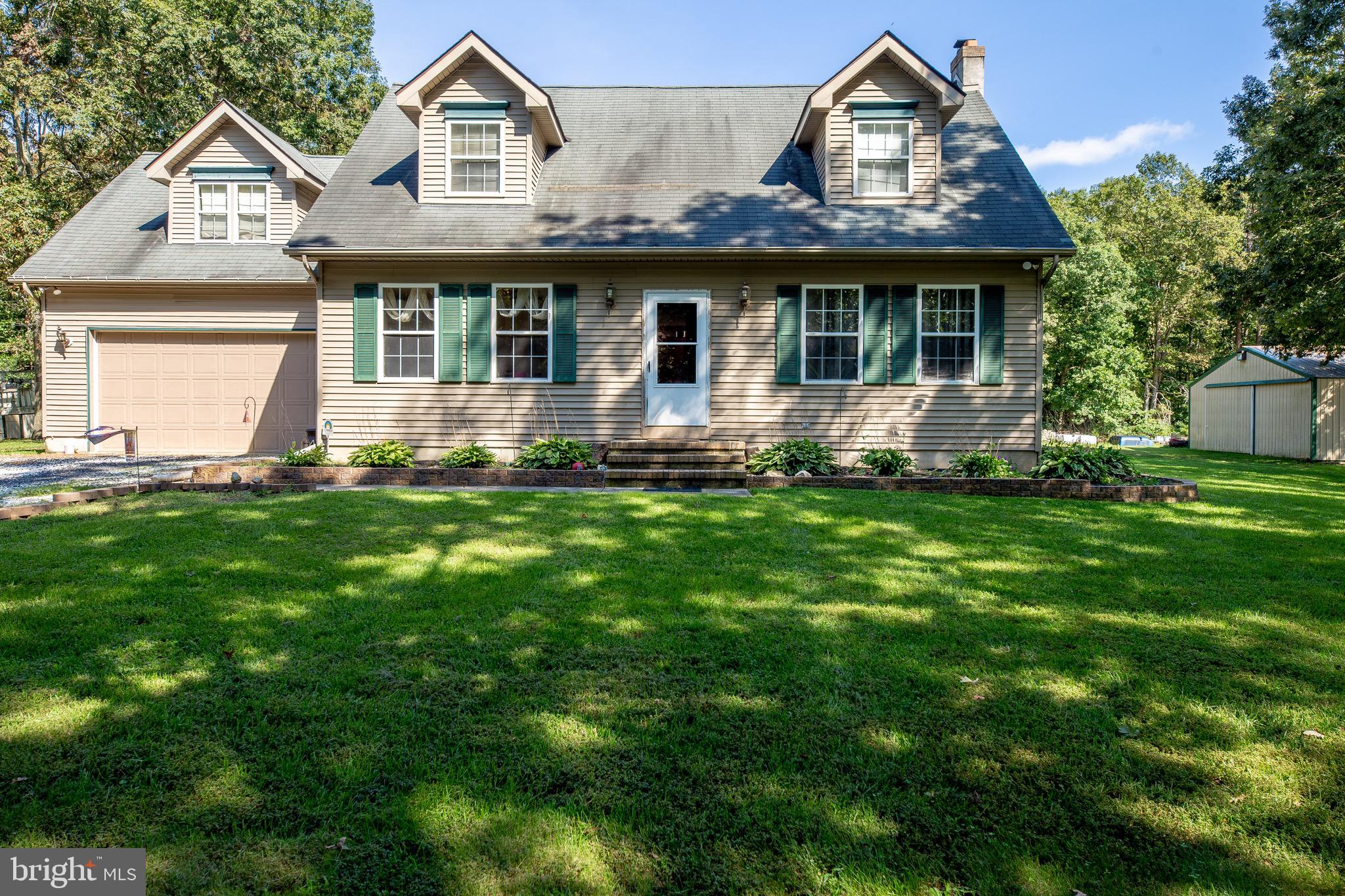 300 Ramah Road Bridgeton, NJ 08302 - Photo 1 of 41 a front view of a house with a garden and yard