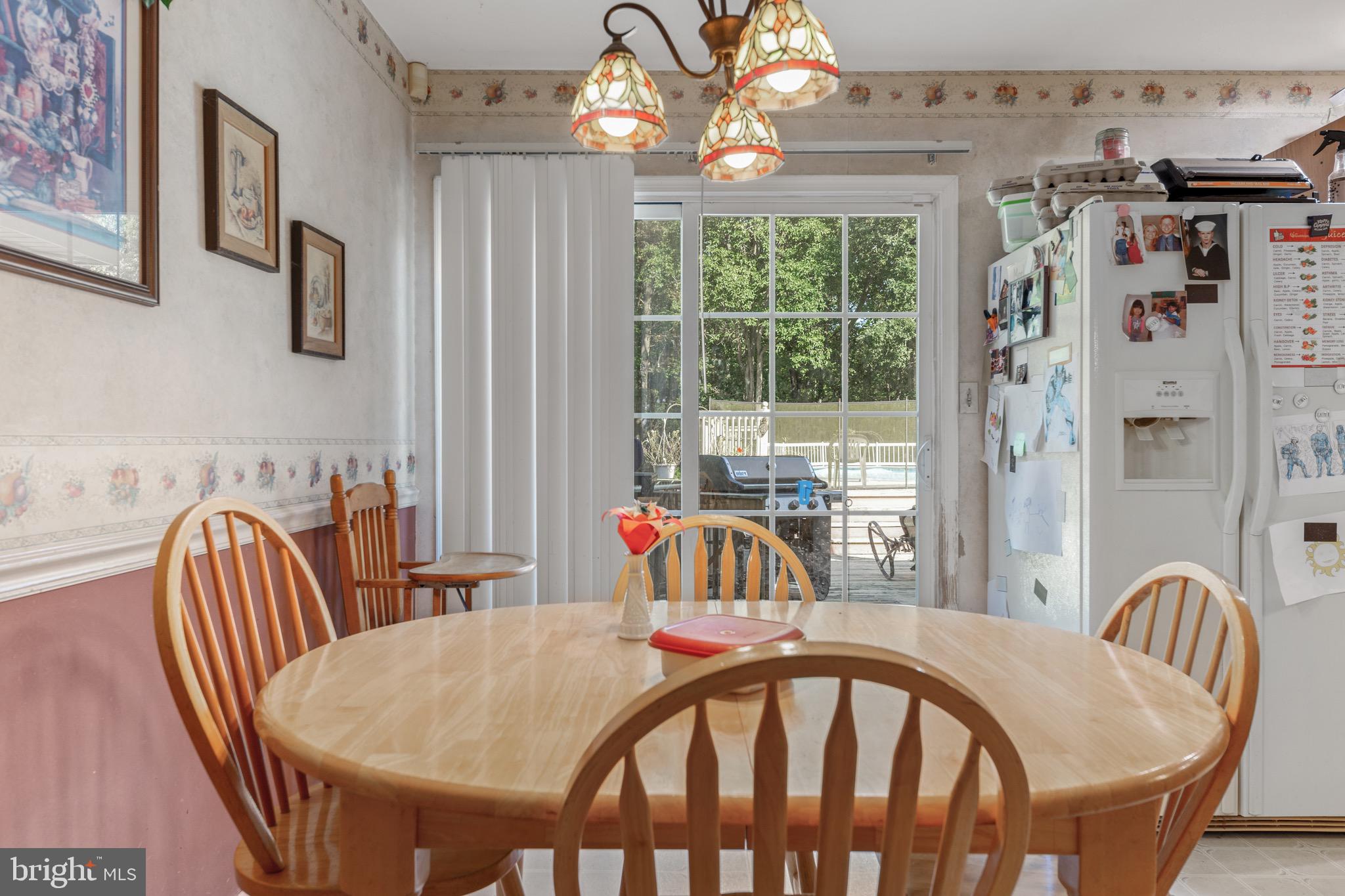 300 Ramah Road Bridgeton, NJ 08302 - Photo 13 of 41 a view of a dining room with furniture and a chandelier