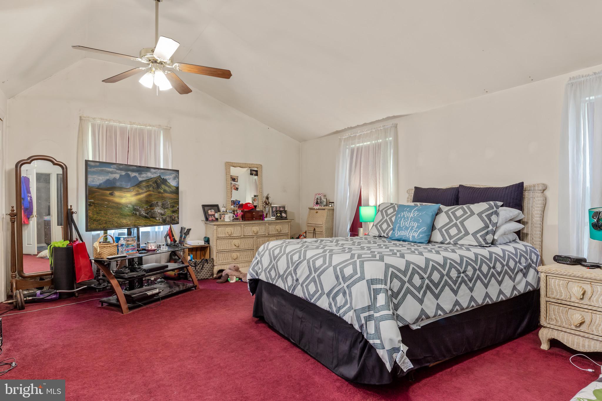 300 Ramah Road Bridgeton, NJ 08302 - Photo 18 of 41 a bedroom with a bed a couch and a chandelier