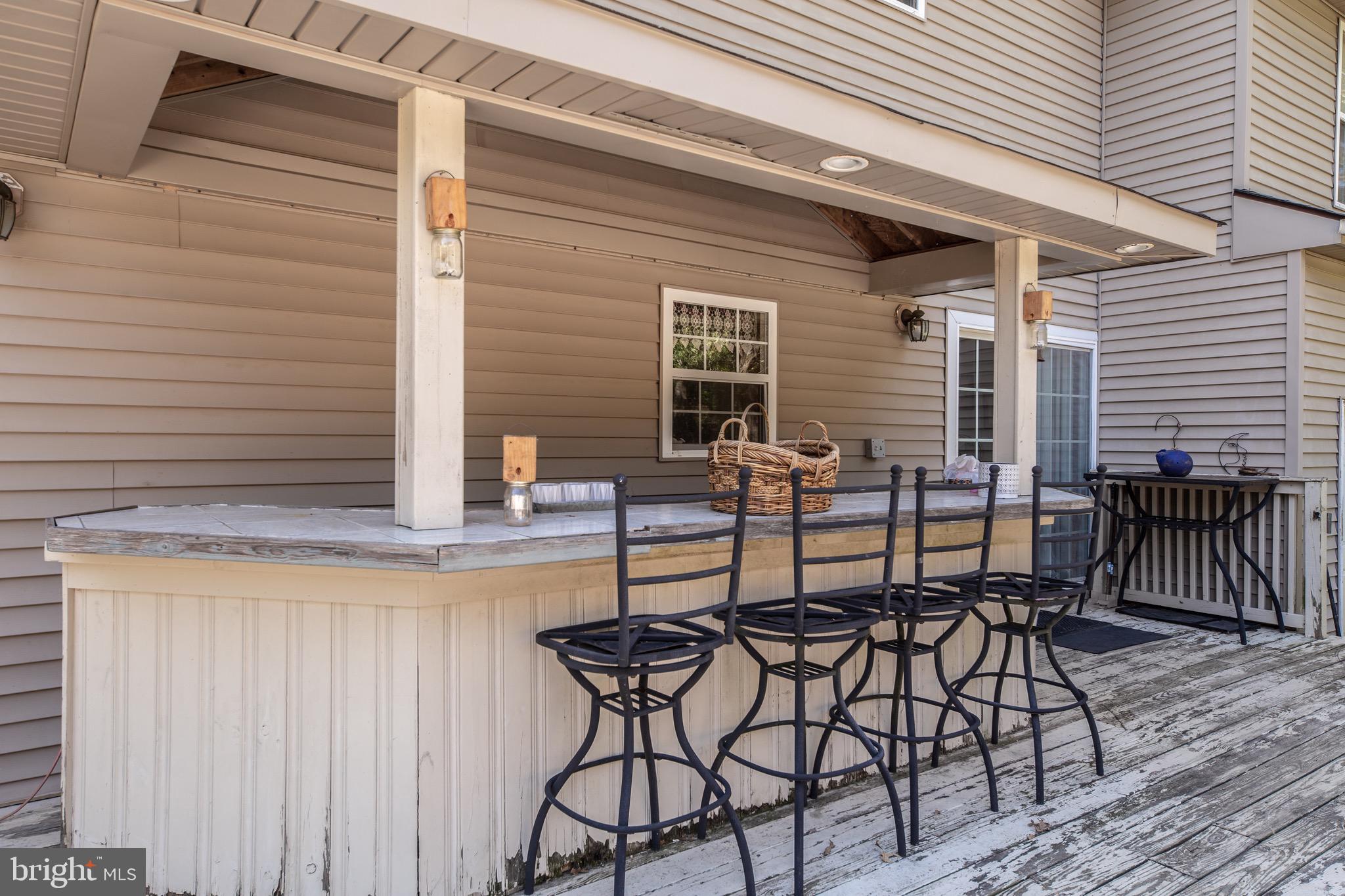300 Ramah Road Bridgeton, NJ 08302 - Photo 24 of 41 a view of backyard with table and chairs and wooden floor