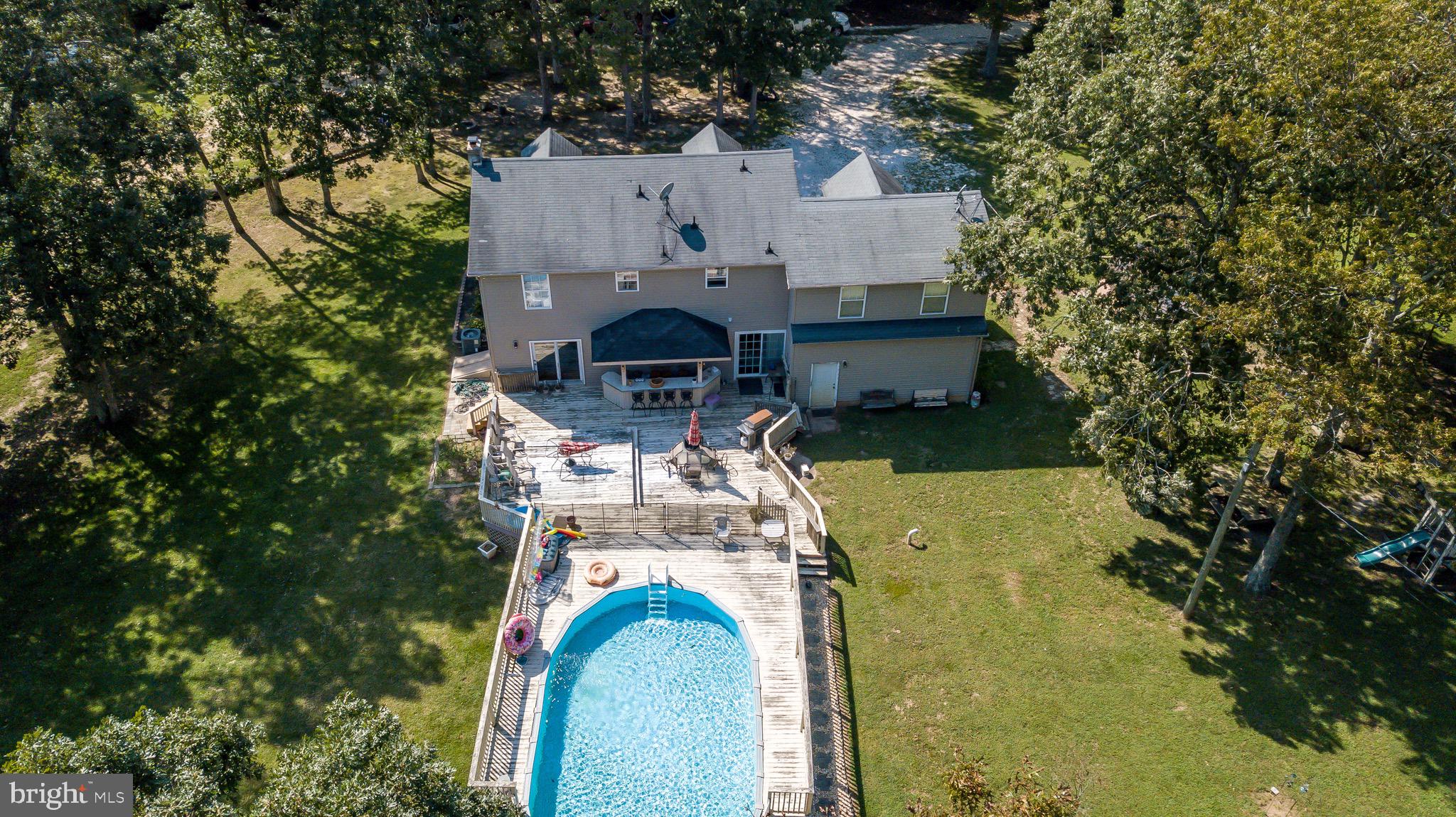 300 Ramah Road Bridgeton, NJ 08302 - Photo 36 of 41 an aerial view of a house with swimming pool and large trees