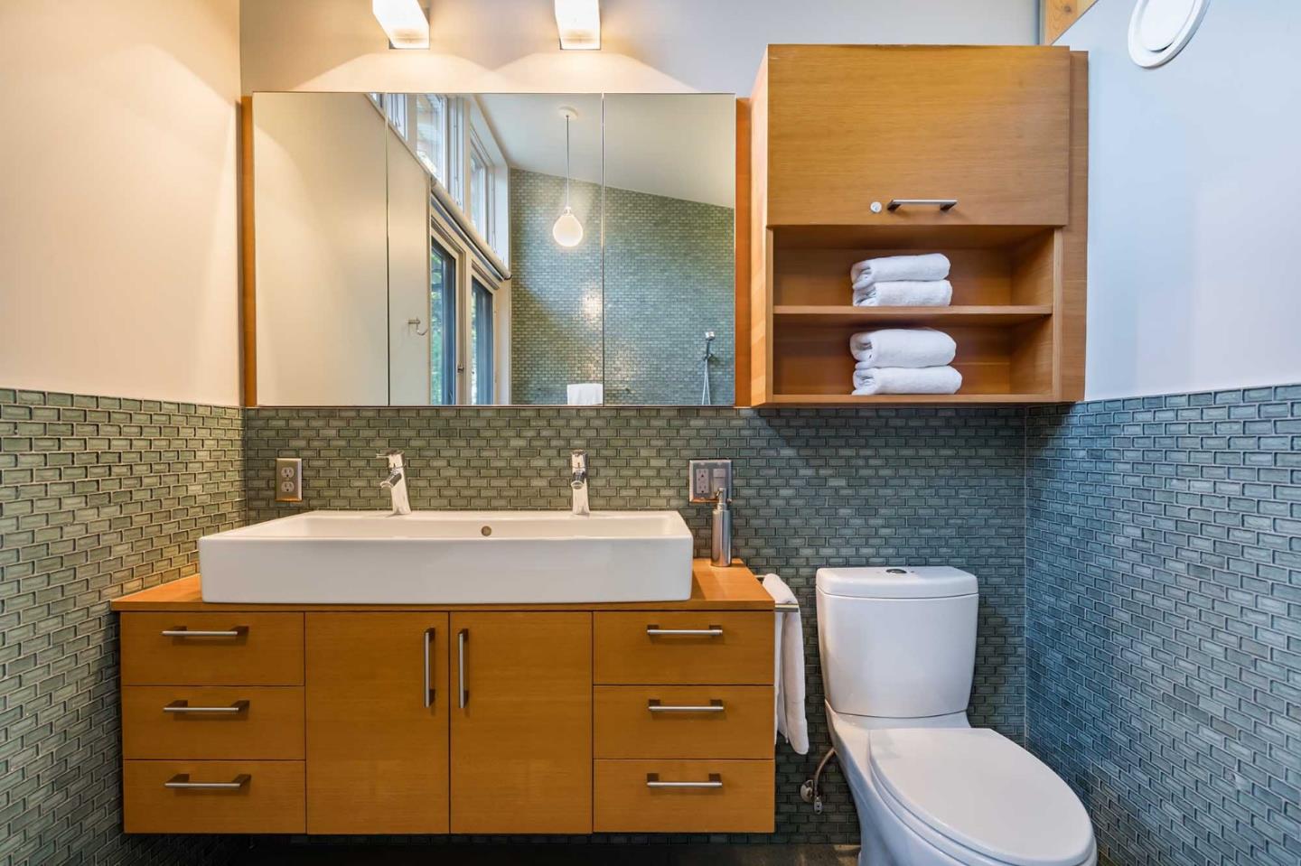 871 Robb Road Palo Alto, CA 94306 - Photo 27 of 35 a bathroom with a toilet sink and mirror