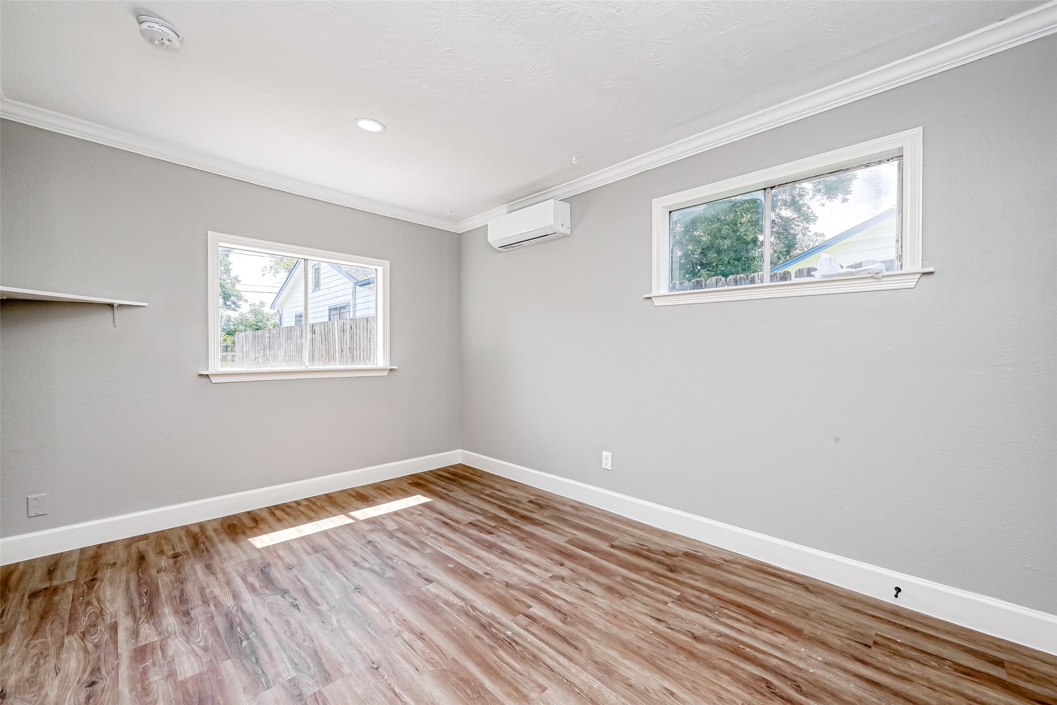 6715 Victoria Street Houston, TX 77020 - Photo 21 of 46 a view of empty room with wooden floor and fan