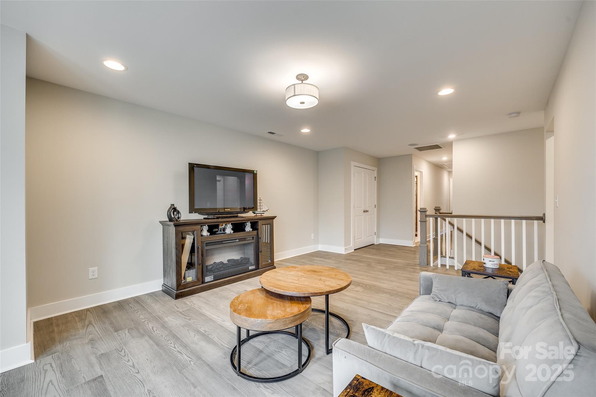 2024 Suttonview Road Fort Mill, SC 29708 - Photo 15 of 41 a living room with furniture and a wooden floor
