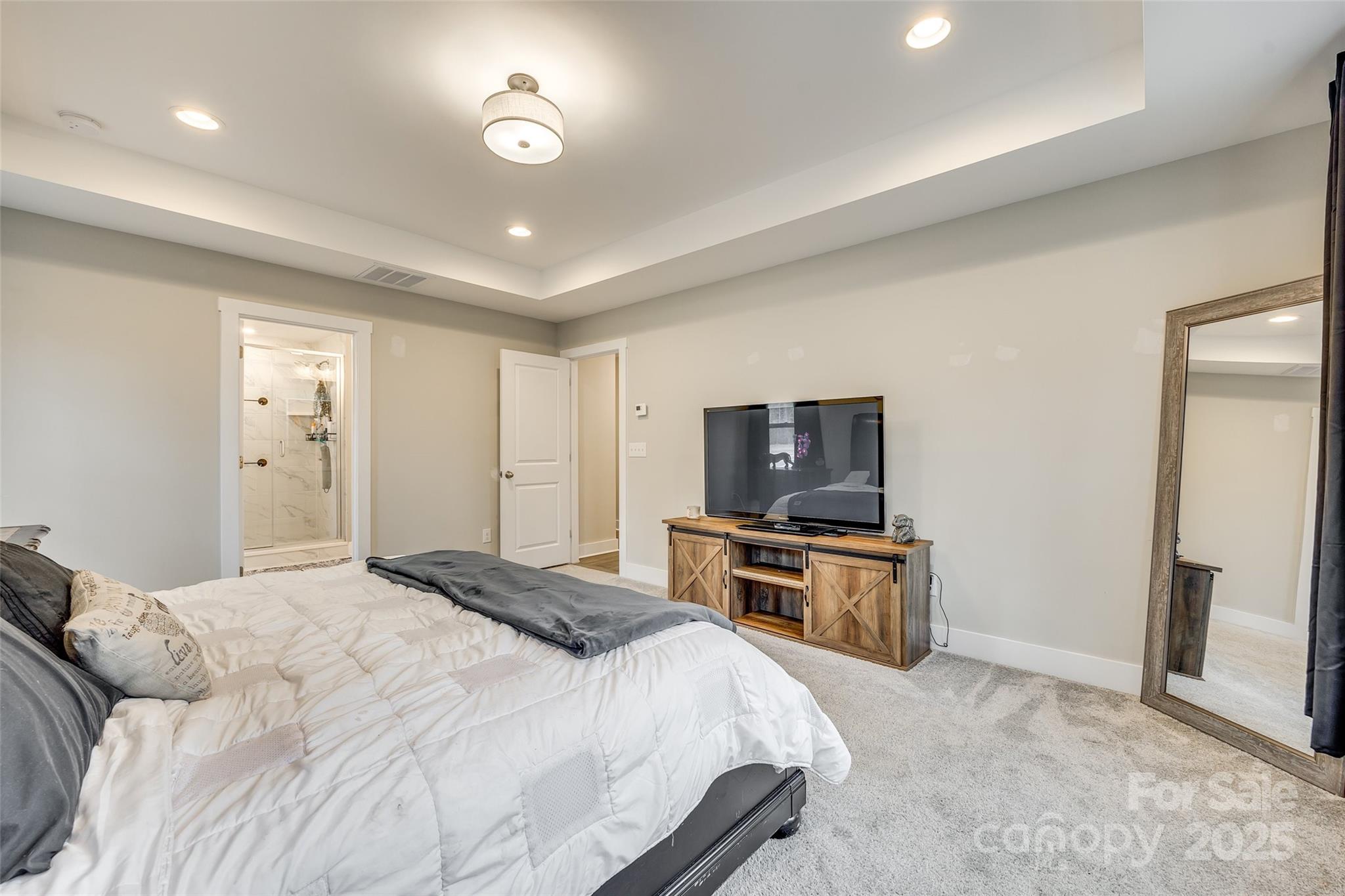 2024 Suttonview Road Fort Mill, SC 29708 - Photo 18 of 41 a spacious bedroom with a bed and furniture