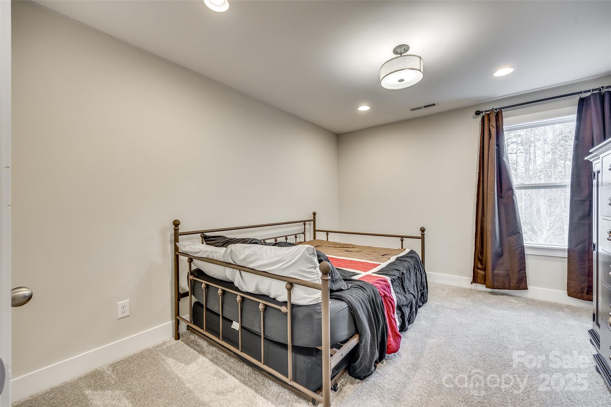 2024 Suttonview Road Fort Mill, SC 29708 - Photo 24 of 41 a bedroom with a bed and a window