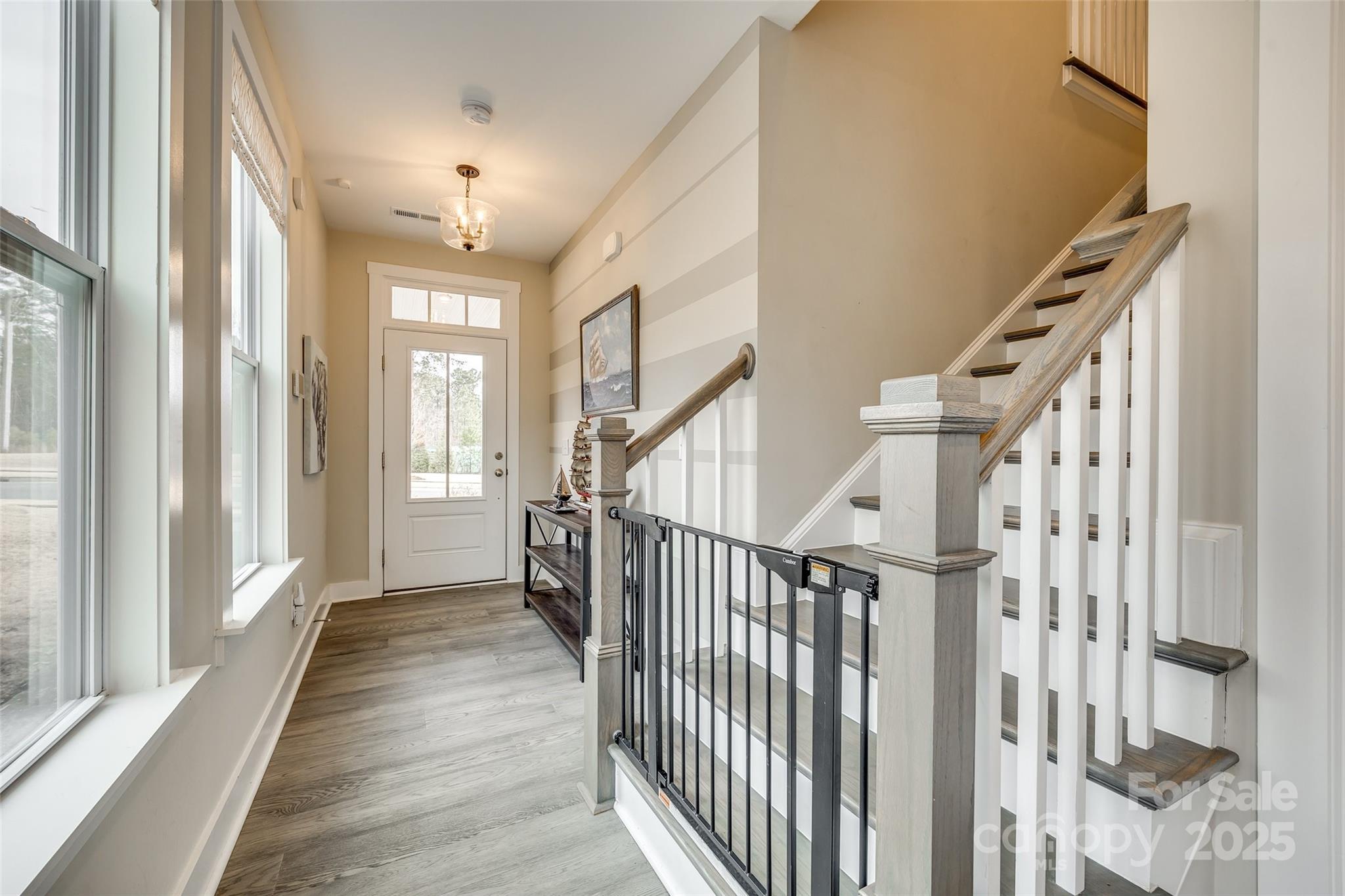 2024 Suttonview Road Fort Mill, SC 29708 - Photo 3 of 41 a view of an entryway with wooden floor and stairs