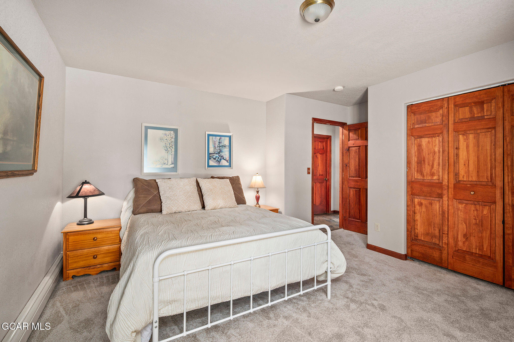 732 Gcr 8311/ Clayton Ranch Road Tabernash, CO 80478 - Photo 42 of 65 a bedroom with a bed and a cabinets