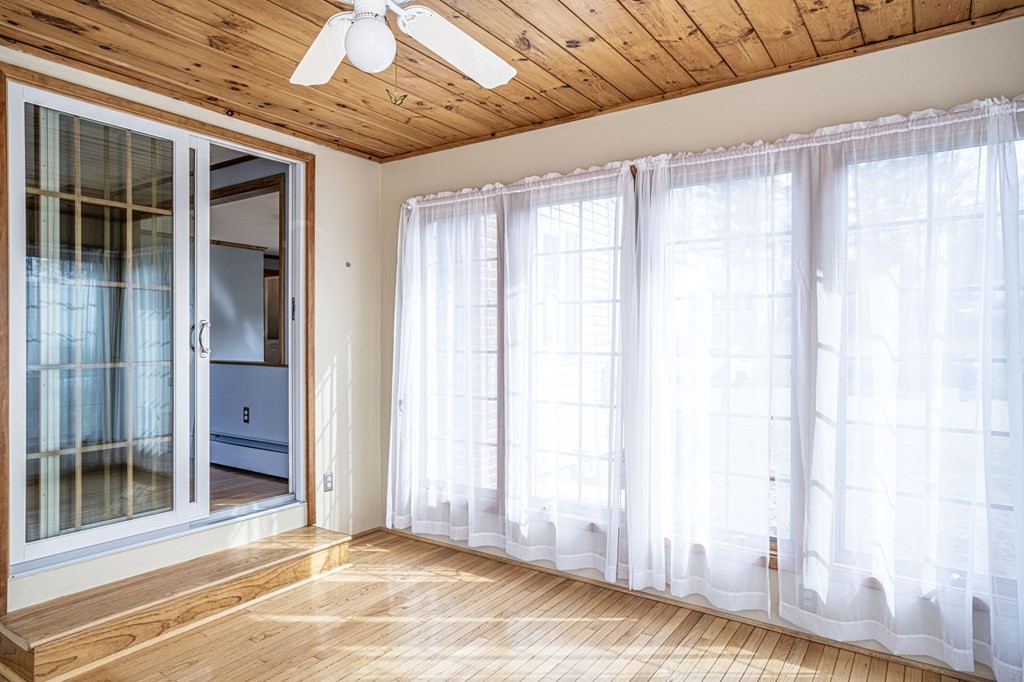 56 Spring Street Plainville, MA 02762 - Photo 12 of 21 a view of an empty room with a window