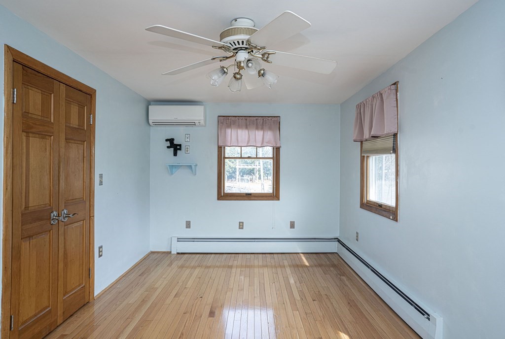 56 Spring Street Plainville, MA 02762 - Photo 13 of 21 wooden floor in an empty room with a window