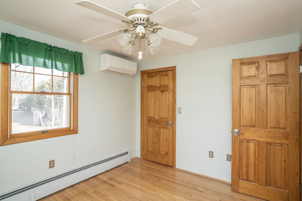 56 Spring Street Plainville, MA 02762 - Photo 16 of 21 wooden floor in an empty room with a window