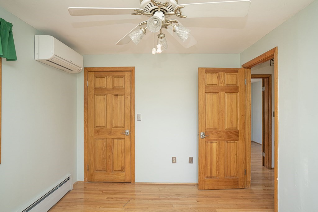 56 Spring Street Plainville, MA 02762 - Photo 17 of 21 a view of an empty room with wooden floor