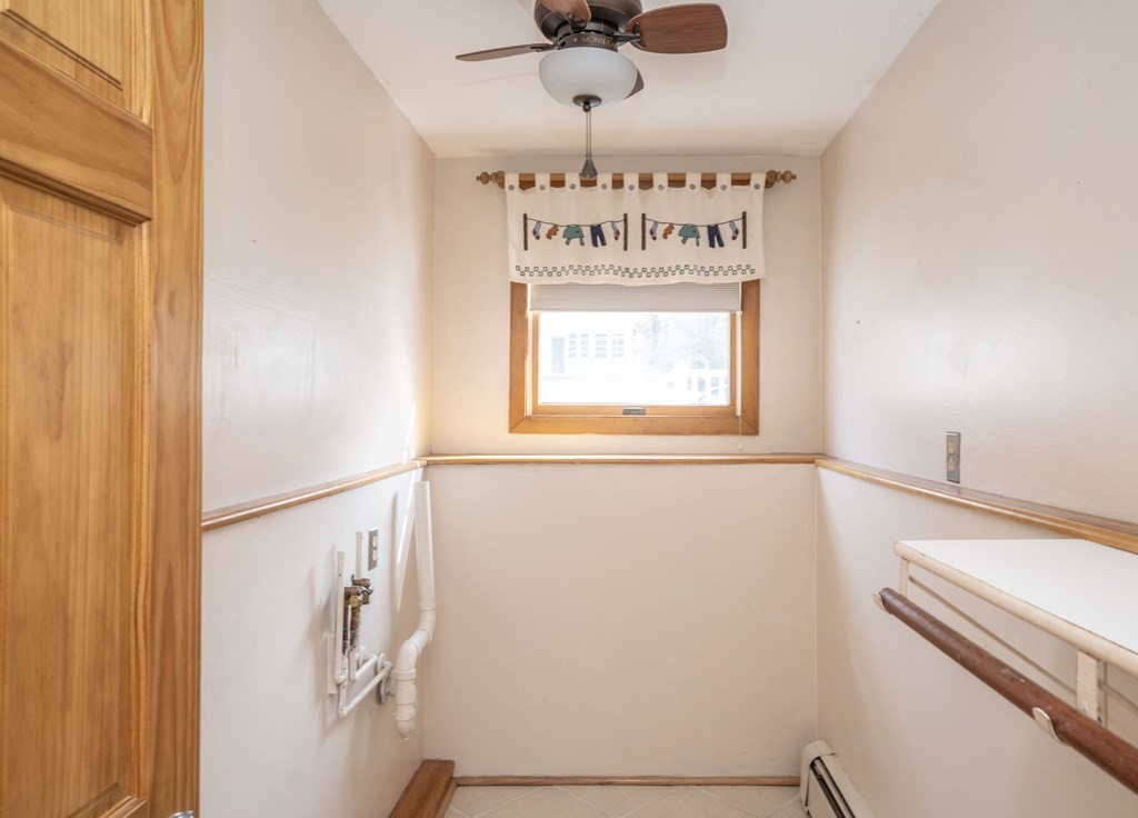 56 Spring Street Plainville, MA 02762 - Photo 19 of 21 a view of a hallway with a window