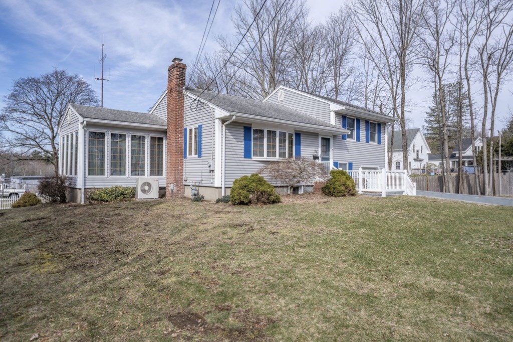 56 Spring Street Plainville, MA 02762 - Photo 2 of 21 a front view of a house with a garden
