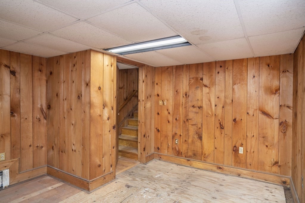 56 Spring Street Plainville, MA 02762 - Photo 21 of 21 a view of entryway with wooden walls