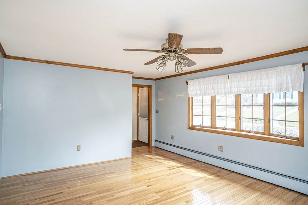 56 Spring Street Plainville, MA 02762 - Photo 5 of 21 a view of an empty room and window