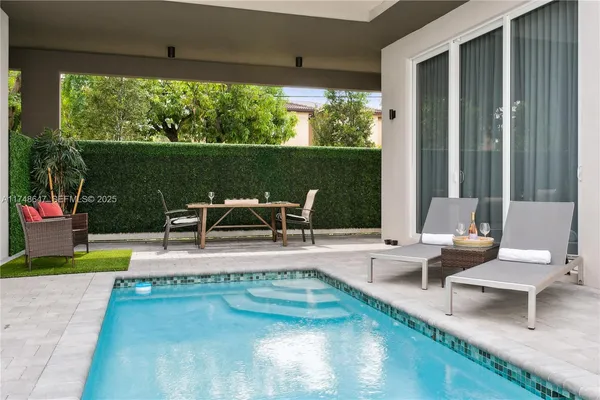 a view of a patio with swimming pool