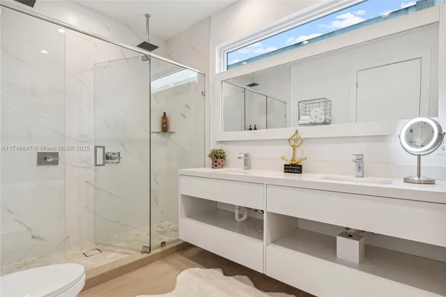 a bathroom with a tub sink mirror and shower