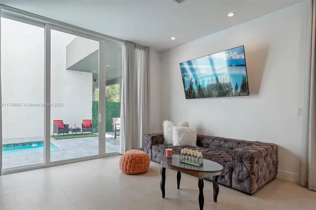 a living room with furniture and a gate