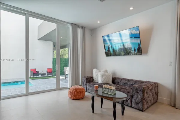 a living room with furniture and a gate