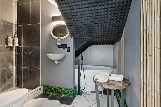 a bathroom with a sink and toilet