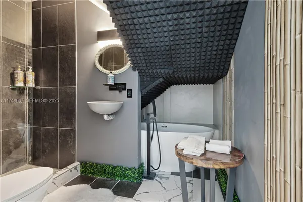 a bathroom with a sink and toilet
