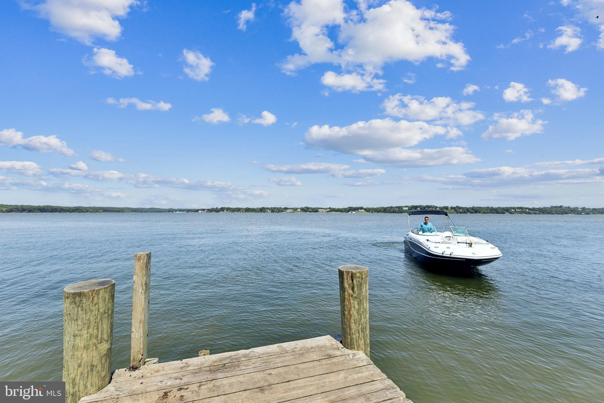 6005 Fenwick Road Bryans Road, MD 20616 - Photo 8 of 9 a view of a lake with lawn chairs