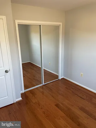 an empty room with wooden floor