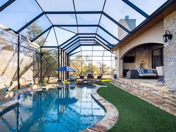 a view of a swimming pool with a patio