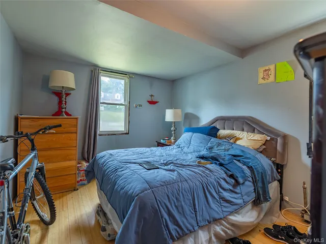 a bedroom with bed and window