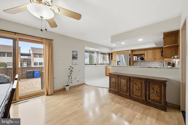 a spacious bedroom with a large bed and a chandelier