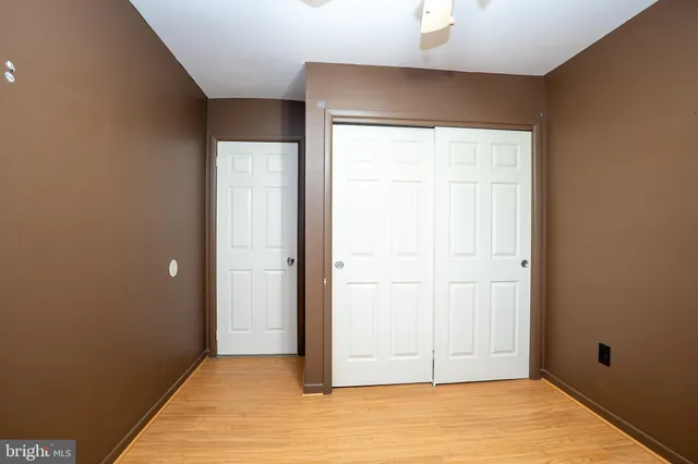 an empty room with closet area