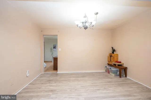 a view of a room with wooden floor and workspace