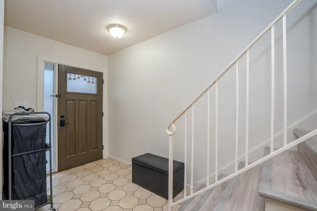 a view of an entryway with wooden floor