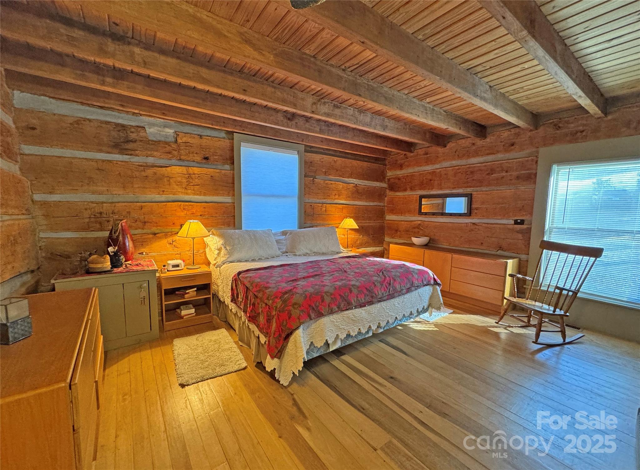 3076 Anderson Cove Road Hot Springs, NC 28743 - Photo 15 of 44 a bedroom with a bed a chair and potted plant on the dresser