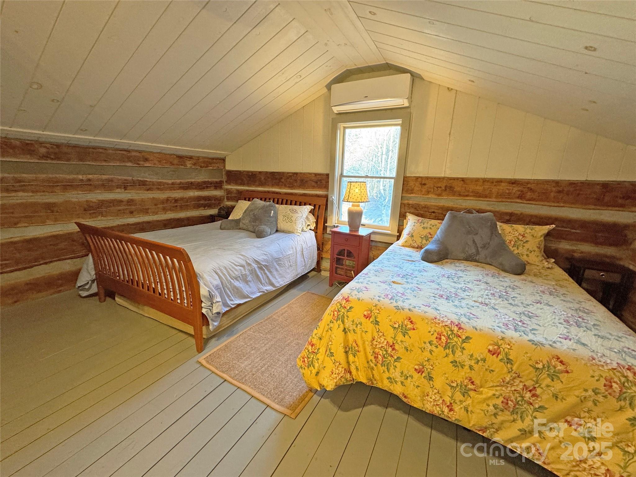 3076 Anderson Cove Road Hot Springs, NC 28743 - Photo 24 of 44 a bedroom with two beds and painting on the wall