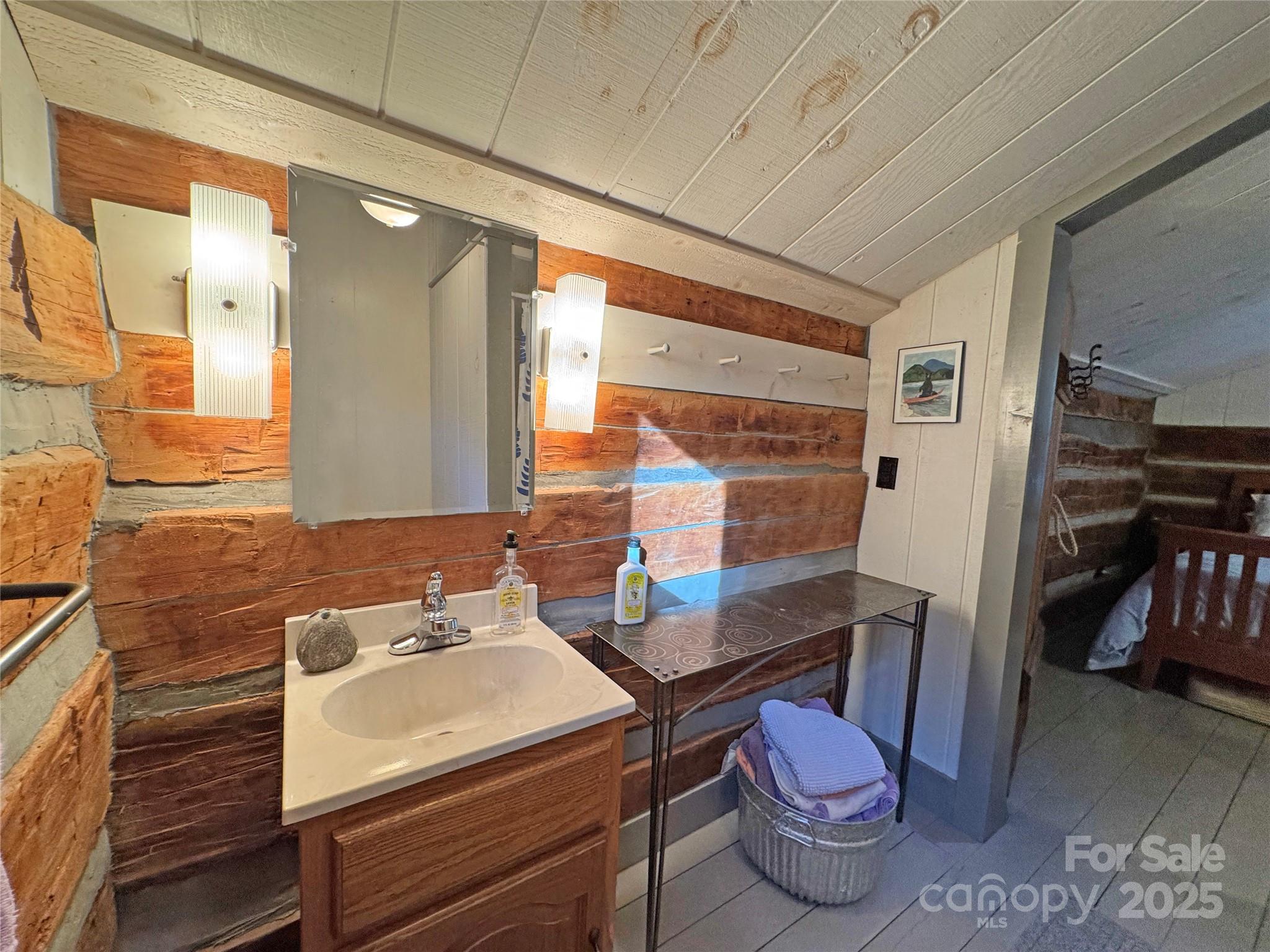 3076 Anderson Cove Road Hot Springs, NC 28743 - Photo 28 of 44 a bathroom with a sink toilet vanity and tub