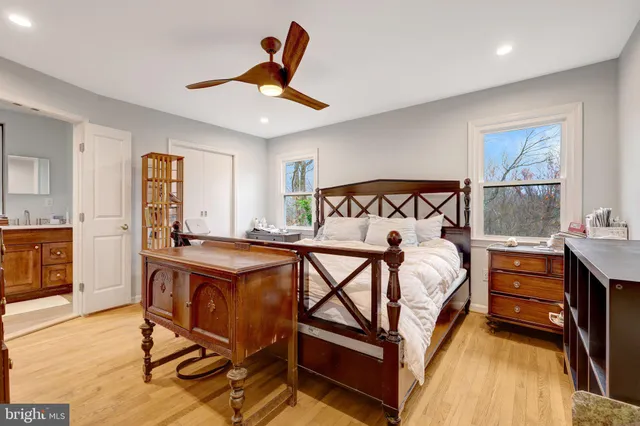 a bed room with a bed and a chandelier