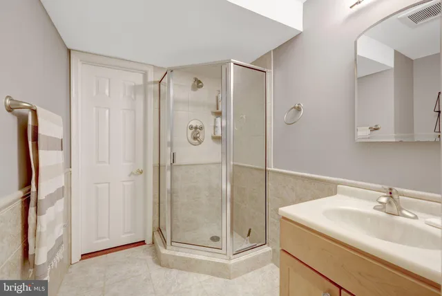 a bathroom with a sink and mirror