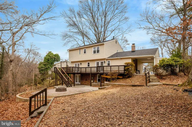 a view of a house with backyard porch and sitting area