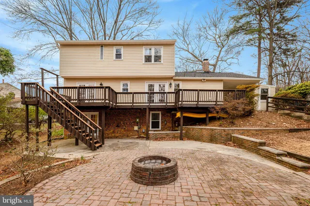 a view of a house with wooden deck