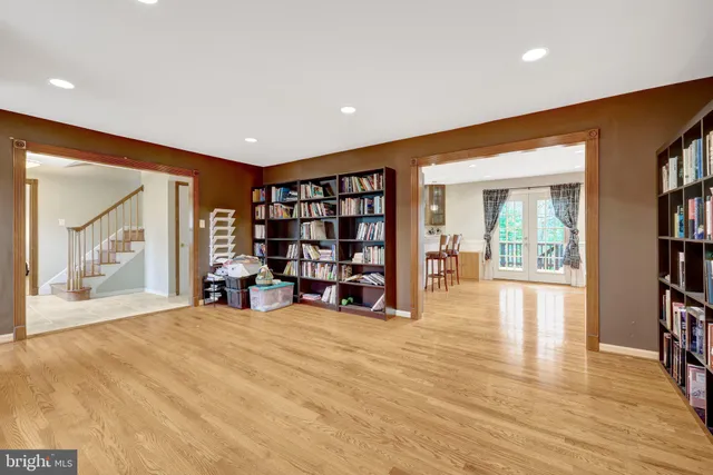 a view of an empty room with window and workspace