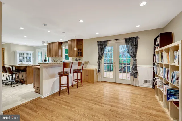 a open kitchen with stainless steel appliances granite countertop a refrigerator and a stove top oven