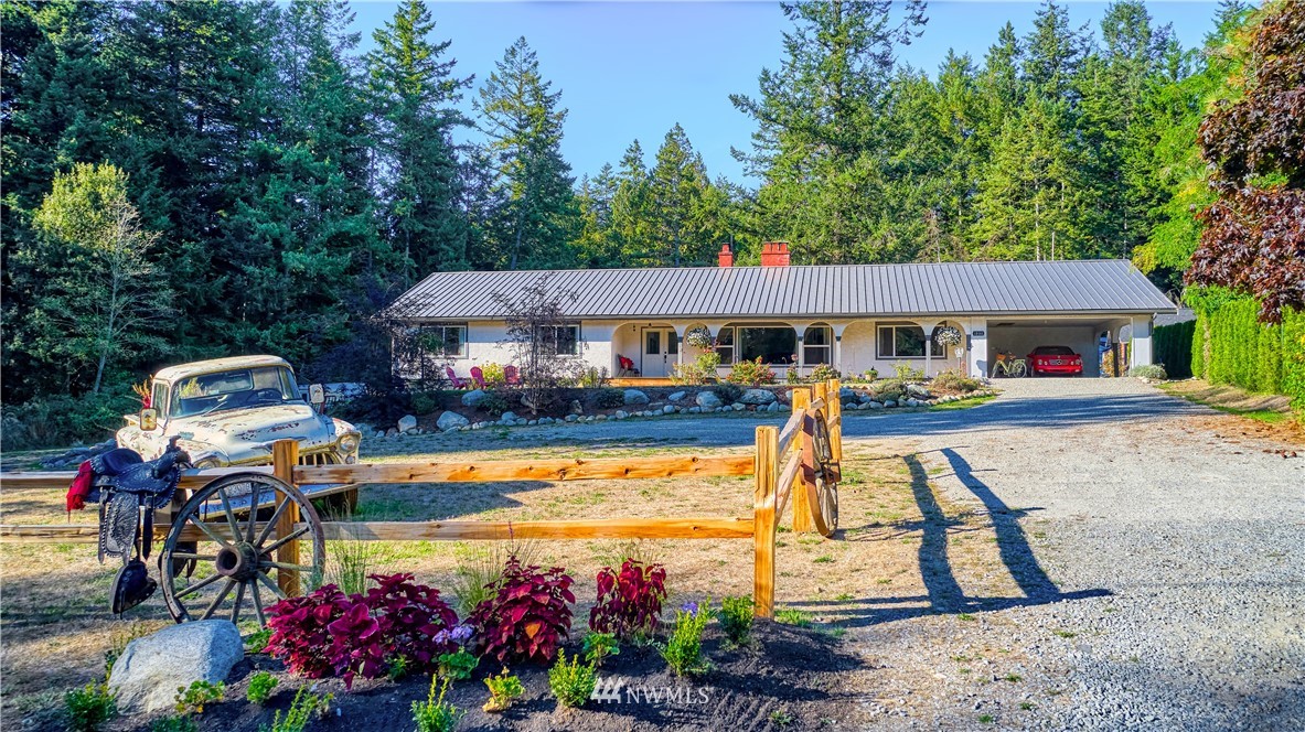 1890 Benson Road Point Roberts, WA 98281 - Photo 1 of 35 a view of a house with swimming pool and sitting area