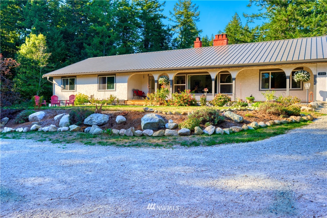 1890 Benson Road Point Roberts, WA 98281 - Photo 3 of 35 a front view of a house with garden