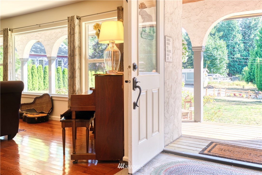 1890 Benson Road Point Roberts, WA 98281 - Photo 22 of 35 a view of a living room and floor to ceiling window