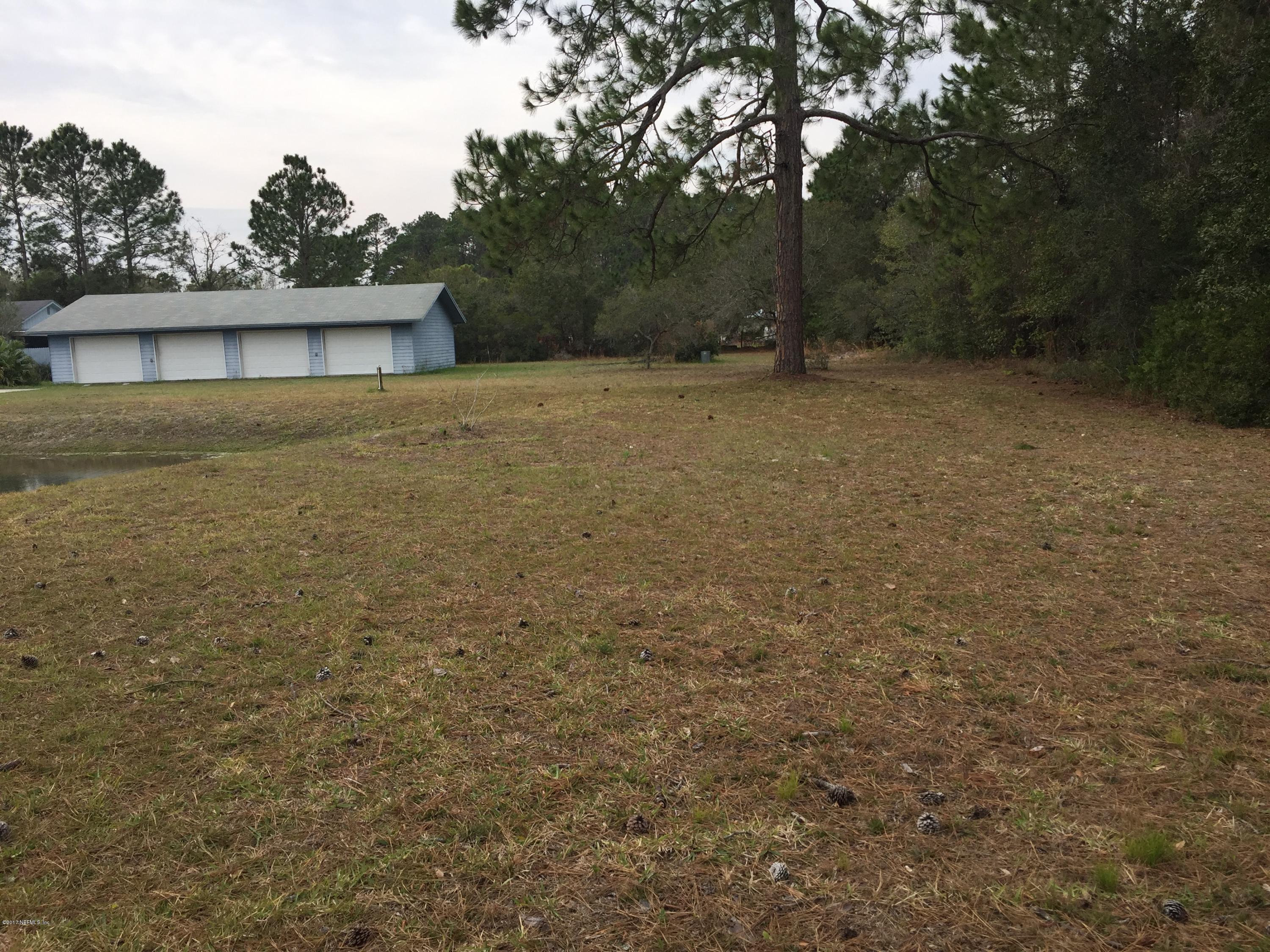 10400 Sawpit Road Jacksonville, FL 32226 - Photo 15 of 30 a front view of a house with a yard